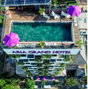 an aerial view of a hotel with a pool and umbrellas at Aria Grand Hotel & Spa in Da Nang