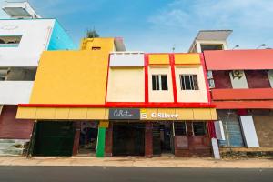 a colorful building on the side of a street at Collection O G Silver Near Airport in Chennai