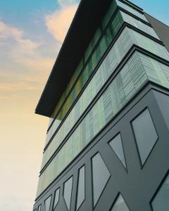 a building with glass windows on the side of it at Elite Hotel & Spa in Mestre