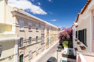 an alley in a city with buildings at Nesha Lucky nr. 23 in Lisbon