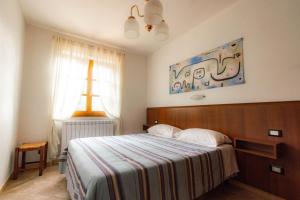 Posteľ alebo postele v izbe v ubytovaní B&B La Bredia