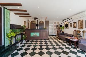 a living room with a checkered floor at Panna Vilas - A Lake Facing Boutique Hotel in Udaipur