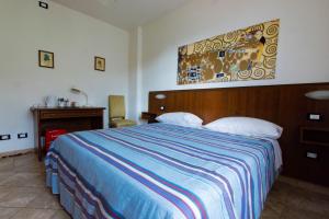 Posteľ alebo postele v izbe v ubytovaní B&B La Bredia