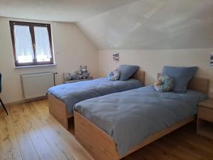 Postel nebo postele na pokoji v ubytování Maison Maurer