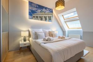 Posteľ alebo postele v izbe v ubytovaní Apartament 24 AbsyntApart Rynek Wrocław