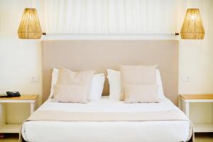 Een bed of bedden in een kamer bij Regiohotel Manfredi