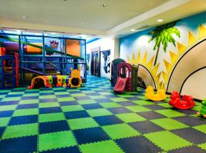 a childrens play room with a checkerboard floor at ～ Sea You in Paradise: Pico de Loro Hamilo Coast ～ in Nasugbu