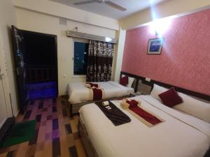 Ліжко або ліжка в номері Hotel Kajiinn