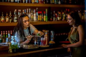 a man and a woman sitting at a bar at Octant Ponta Delgada in Ponta Delgada