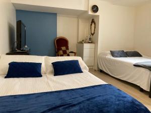 Posteľ alebo postele v izbe v ubytovaní Une chambre chez nous, à 12 minutes de Paris