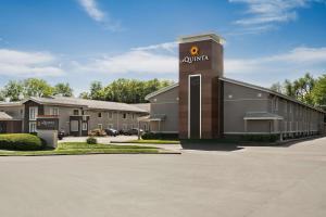 a building with a clock on top of it at La Quinta Inn Lexington-Horse Park in Lexington