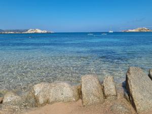 a group of rocks in the water near the beach at Affittimoderni La Maddalena - MADA14 in La Maddalena