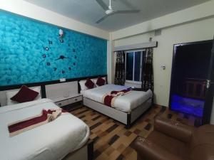 Ліжко або ліжка в номері Hotel Kajiinn