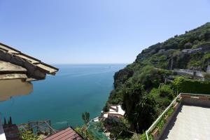 a view of a large body of water on a hill at La Lanterna in Cetara