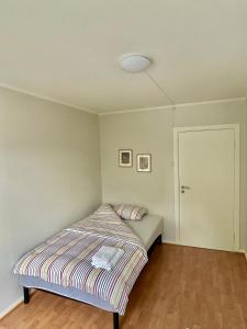 Postel nebo postele na pokoji v ubytování Gjestehuset Borggata 18