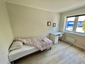 Postel nebo postele na pokoji v ubytování Gjestehuset Borggata 18