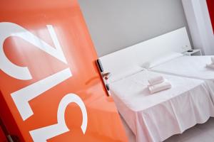 Postel nebo postele na pokoji v ubytování Hotel DL Port