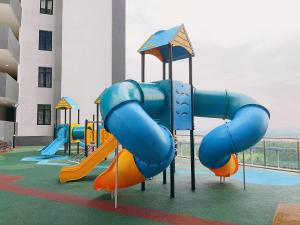 a playground with a slide in a building at Legoland 2RB HappyBunny Max8px in Nusajaya