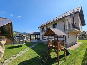 a playground in the yard of a house at Casa Diecilor in Vatra Dornei