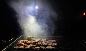 a bunch of meat cooking on a grill at Mahoora Wilpattu - by Eco Team in Wilpattu