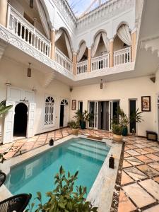 an indoor pool in a large house with a large ceiling at RIAD DREAMS in Marrakesh