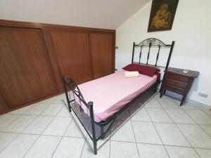 A bed or beds in a room at Casa di Vacanza Marina di Davoli