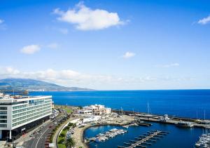 a view of a harbor with boats in the water at Octant Ponta Delgada in Ponta Delgada