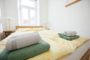 Posteľ alebo postele v izbe v ubytovaní Kiwi Apartment Vienna