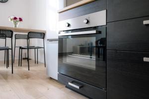 Kuchyňa alebo kuchynka v ubytovaní Restful Stay Apartment