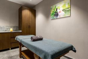 a room with a table with a towel on it at Ramada by Wyndham Istanbul Umraniye in Istanbul