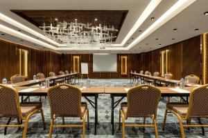 a large conference room with a large table and chairs at Ramada by Wyndham Istanbul Umraniye in Istanbul