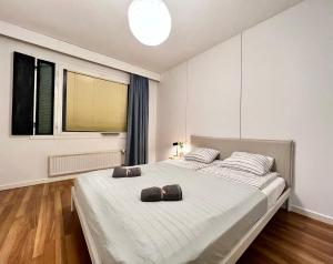 Un pat sau paturi într-o cameră la Oku Asunto - Jokipohja