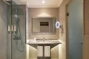 a bathroom with a sink and a shower at Casablanca Marriott Hotel in Casablanca