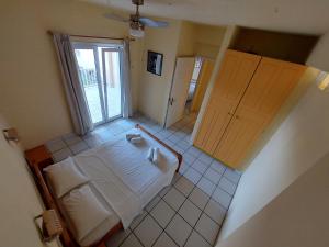 Ένα ή περισσότερα κρεβάτια σε δωμάτιο στο Kidonakia Apartments +10 φωτογραφίες