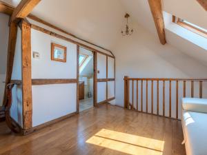 an attic room with a sliding door and a staircase at Pass the Keys Hidden Gem in Stunning Location 