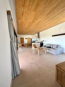 a living room with a couch and a table at Villa Lavayarena in La Oliva