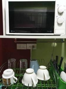 Kuchyň nebo kuchyňský kout v ubytování Smile Capsule Hostel