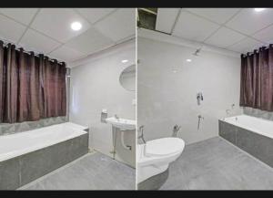 een badkamer met een toilet, een bad en een wastafel bij hotel stay inn in Ahmedabad