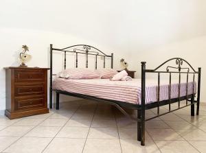 A bed or beds in a room at Casa di Vacanza Marina di Davoli