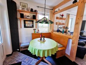 a living room with a table and a couch at Ferienwohnung "Carinerland" mit Terrasse in Ostseenähe 