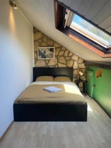 a bedroom with a bed in a room with a window at Private Room in Esch-sur-Alzette in Esch-sur-Alzette