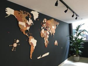 a map of the world on a wall at First Euroflat Hotel in Brussels