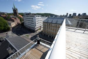 a man standing on the roof of a building at Bob W Oslo Gamle in Oslo
