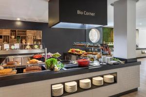 a buffet line with a lot of food at Alcudia Garden Aparthotel in Port d'Alcudia