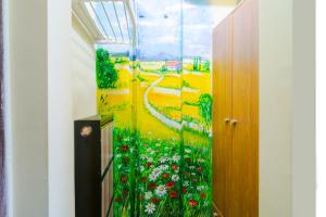 a mural of a field of flowers in a hallway at The Top Spot - Cute Little Studio in the Center by Flat Mаnager in Sofia