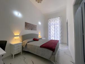 A bed or beds in a room at Palazzo degli Artigiani Appartamento in Centro
