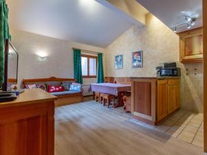 a living room with a couch and a table at Appartement Val-d'Isère, 4 pièces, 8 personnes - FR-1-694-208 in Val-d'Isère