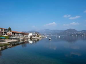 a large body of water with a boat in it at Spaghetti & Cappuccino Beach Villa in Pella