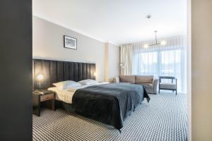Voodi või voodid majutusasutuse Hotel Leda Spa - Adults Only toas