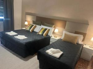 Posteľ alebo postele v izbe v ubytovaní Appia Avenue 639